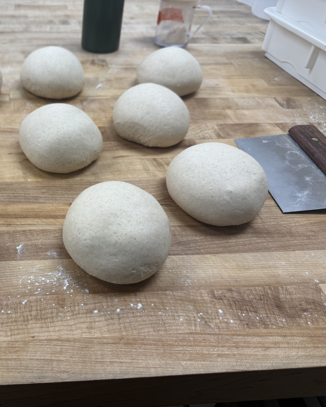 Dough balls resting on the bench