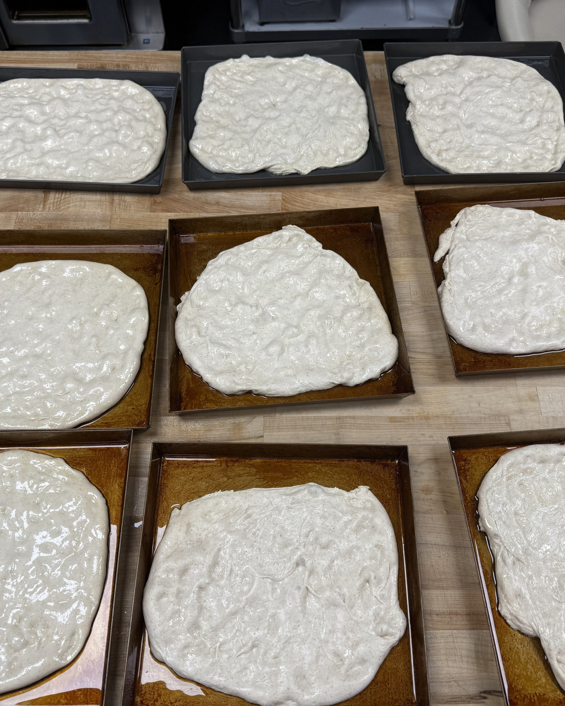 Dough proofing in oiled pans